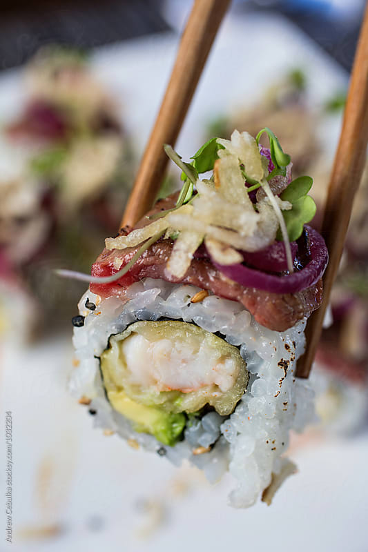 Surf and Turf Sushi roll with chopsticks