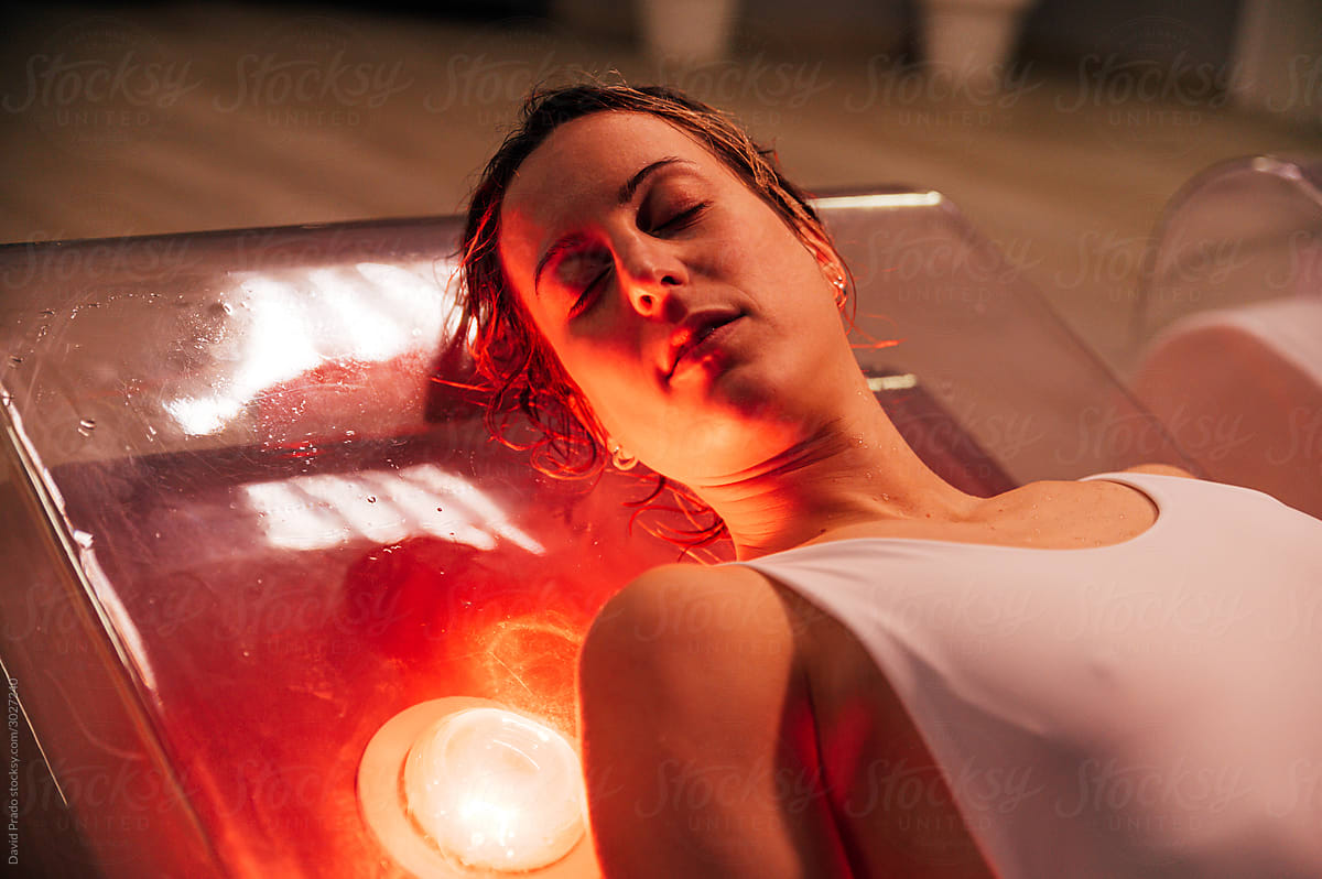 Relaxing woman in red lights