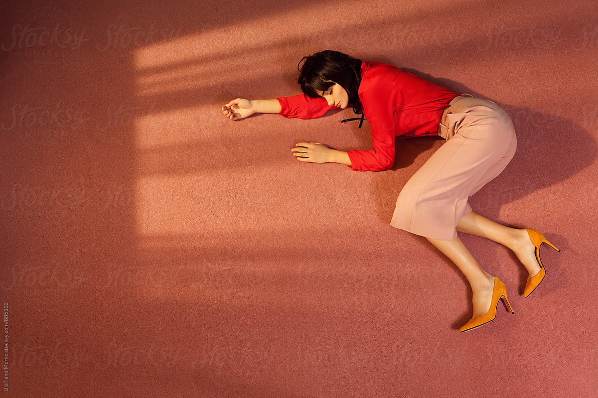 Woman Lying Down On The Floor Of A Room by Stocksy Contributor