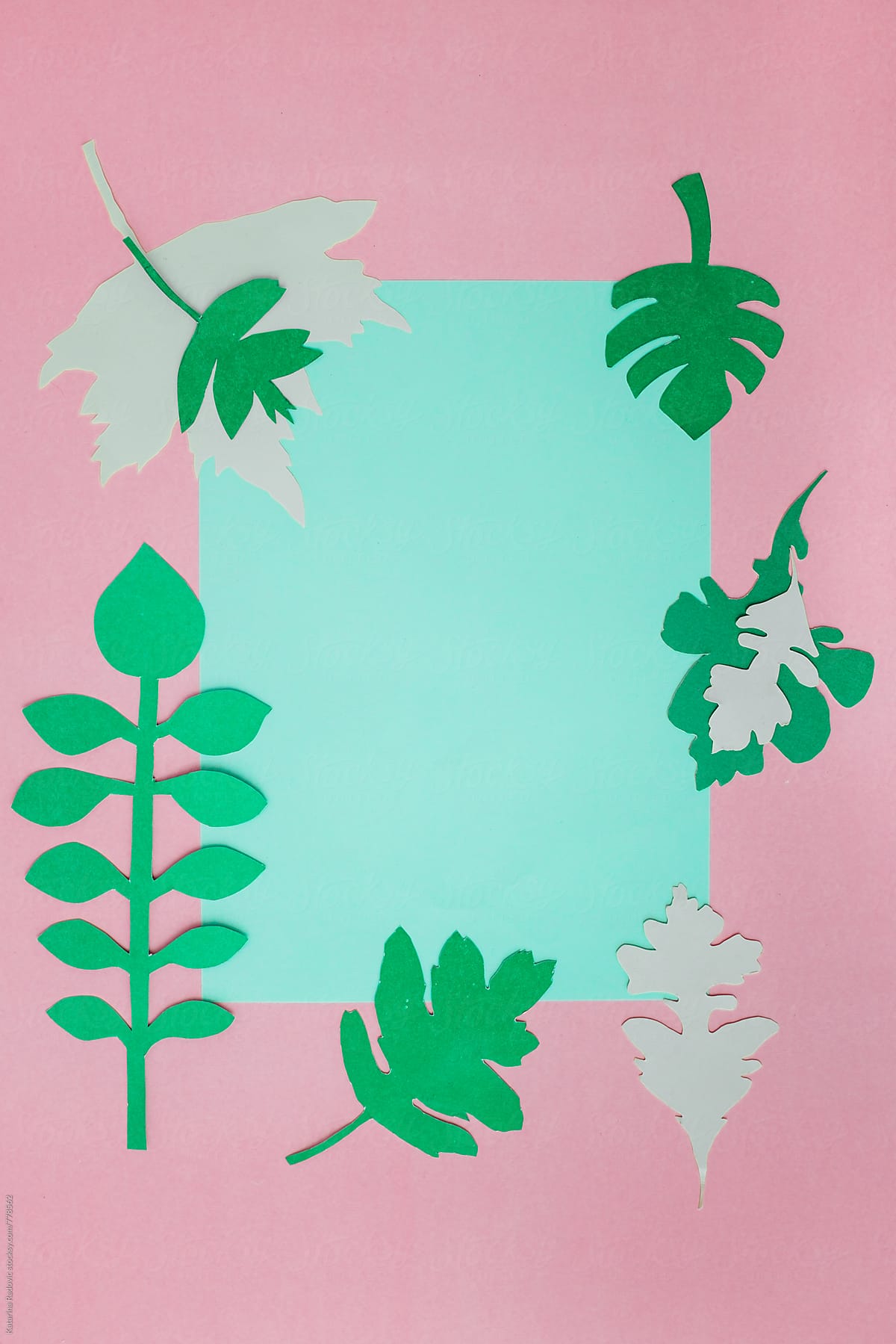 Paper Leaves Arranged with a Pink Pastel Background