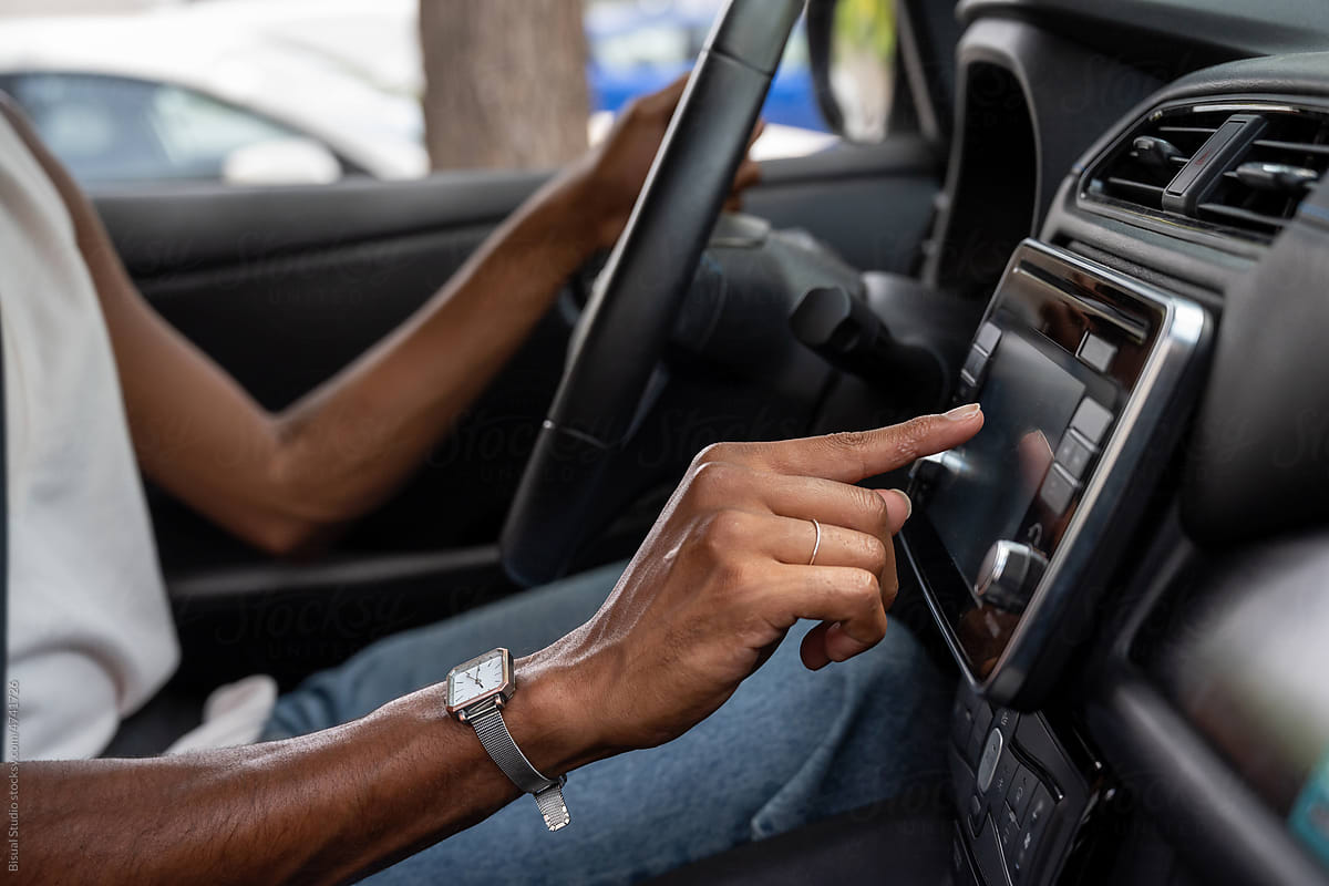 Black man Using GPS Navigator In Car