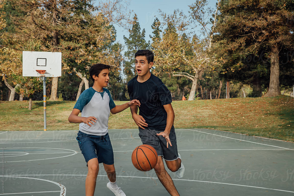 Boys Playing One on One Basketball