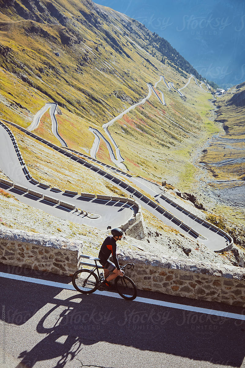 Cyclist resting in moutains.