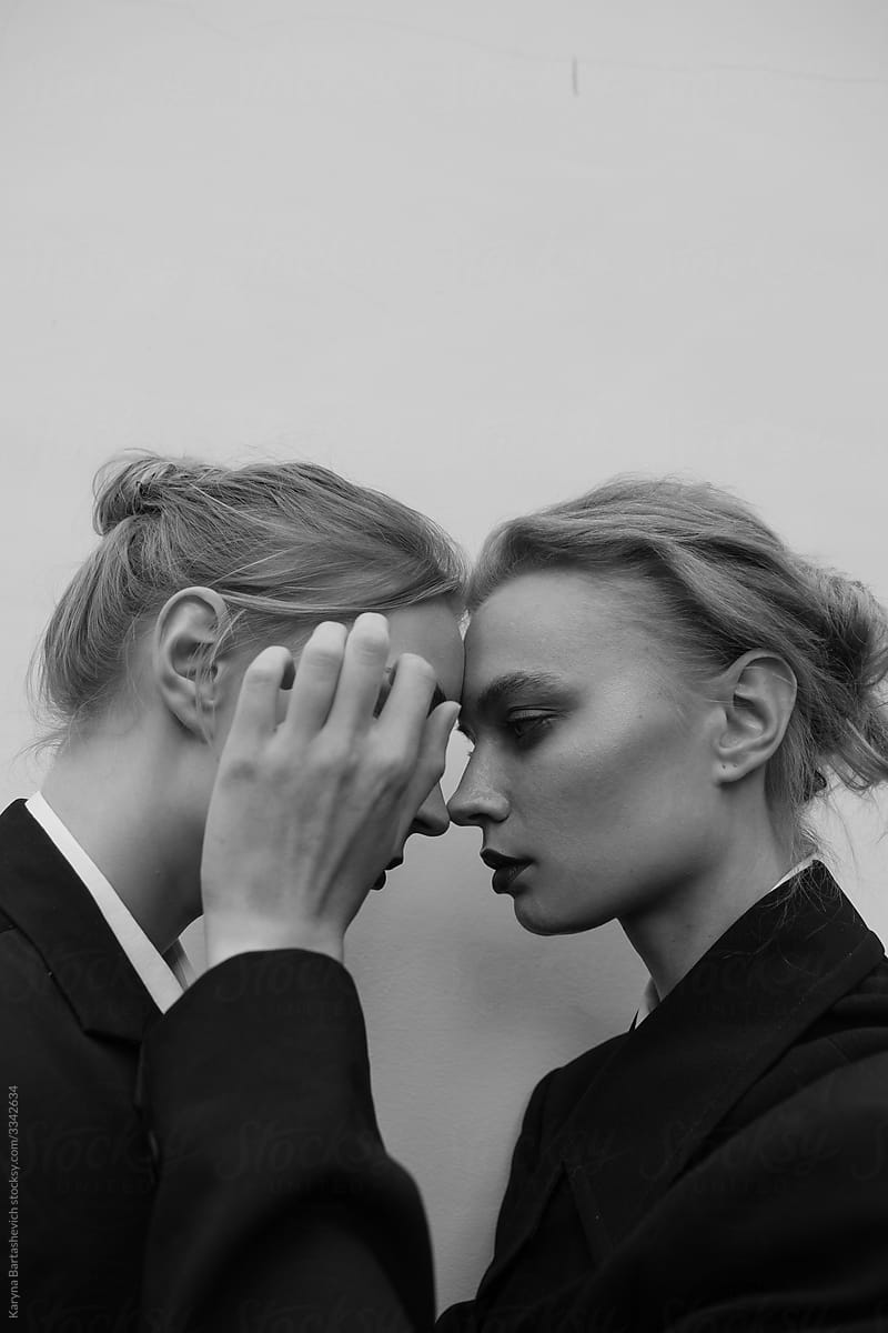 black and white portrait of two sisters standing in profile