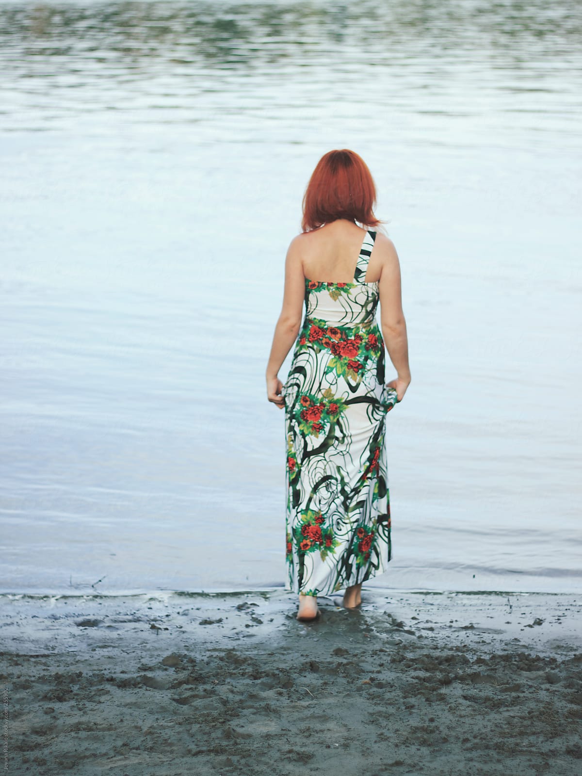 Back View Of A Young Woman Walking Into Water By Stocksy Contributor