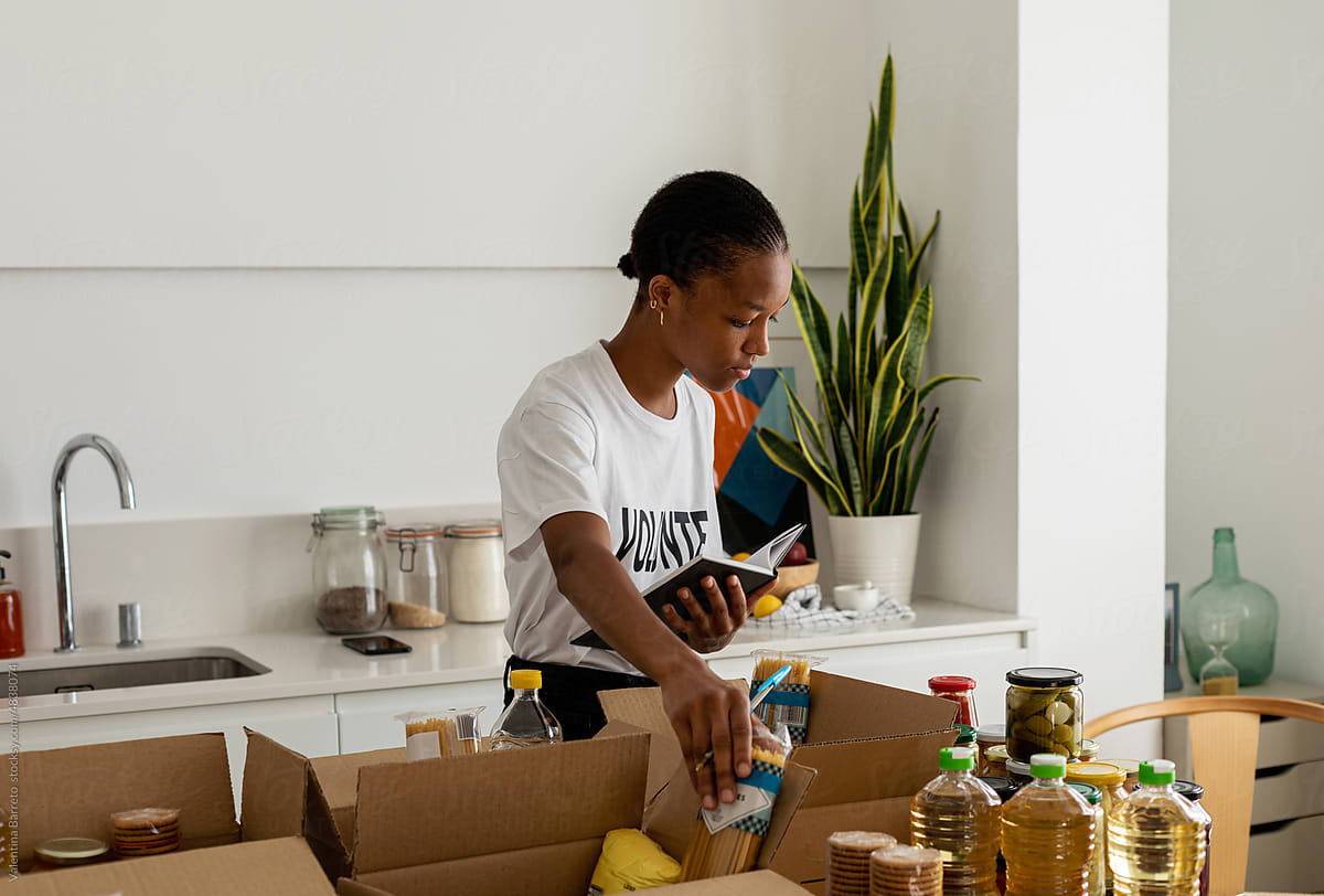 young  Woman Preparing Food Packages