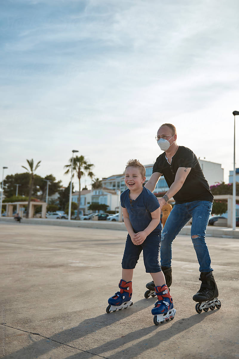 Father and son with roller skates