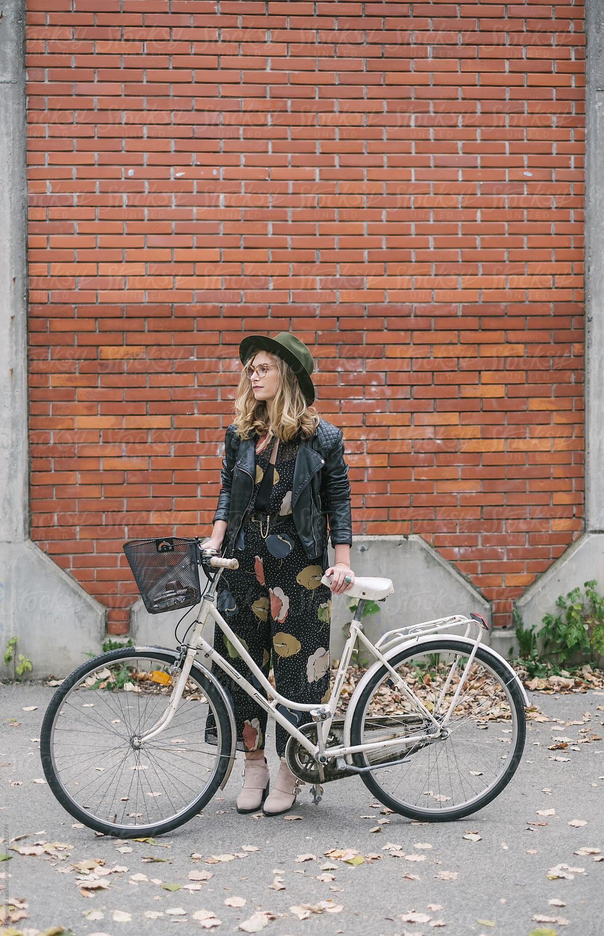 Fashionable Young Woman With Her Bicycle In The Fall Season
