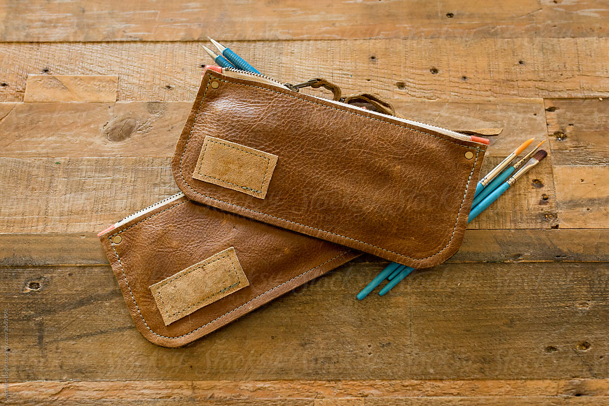 Leather pencil cases with art supplies