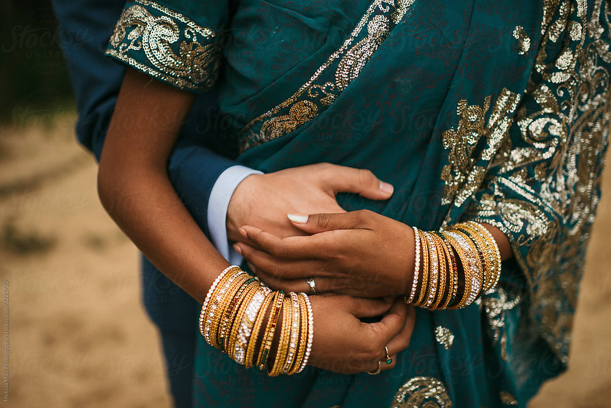 Indian bride holding her husband