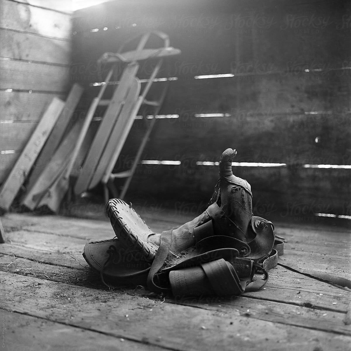 Dusty saddle on a barn floor