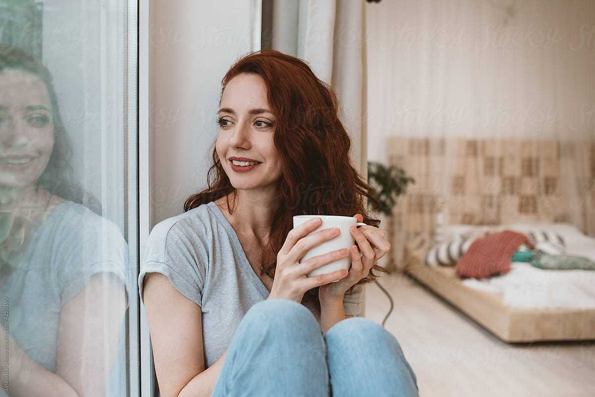Woman having tea at home