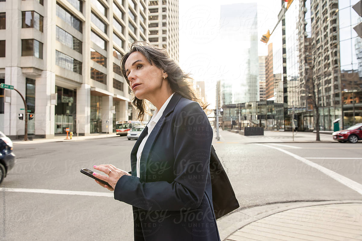 Confident Business Woman Looking Down Street