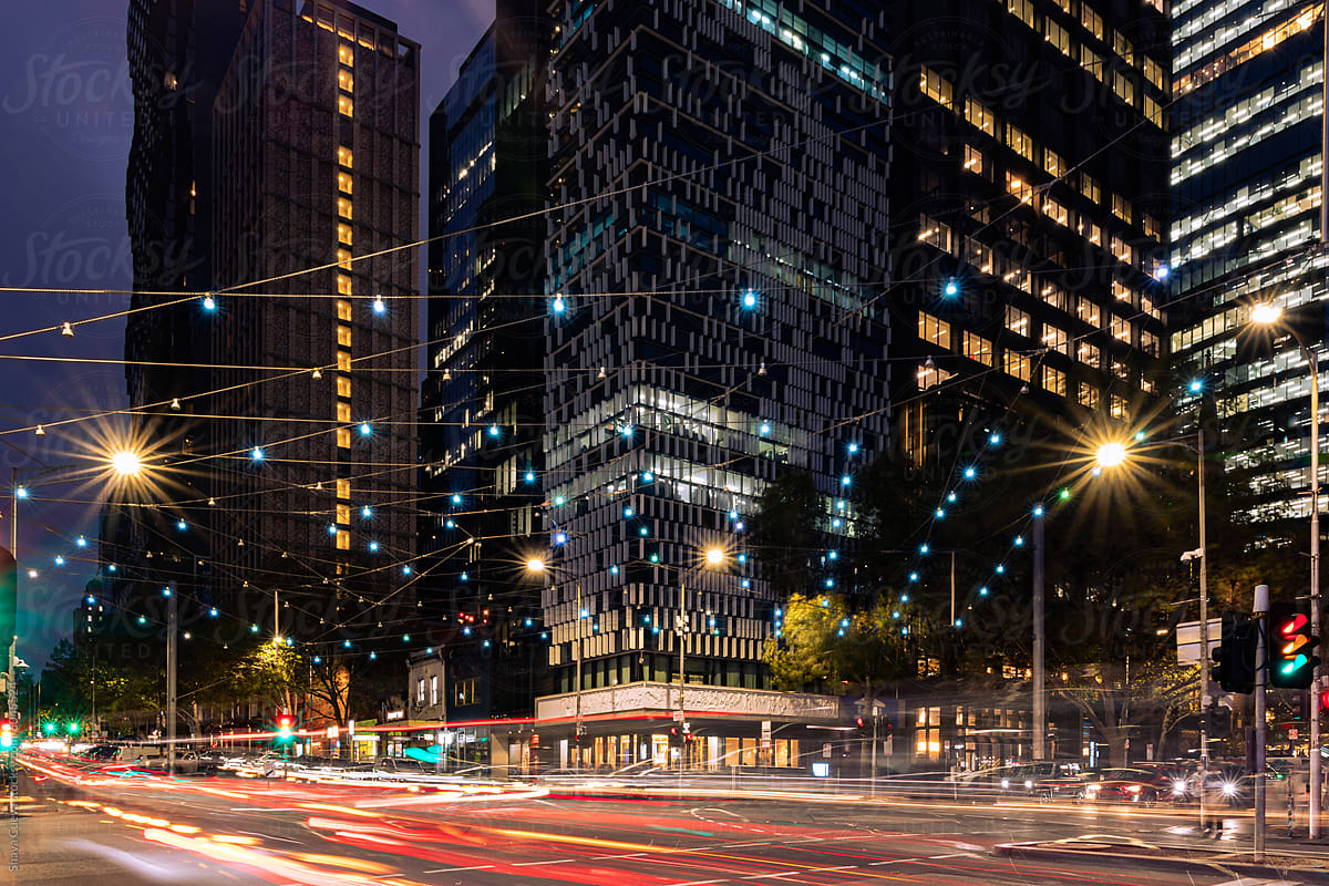 buildings in the city of Melbourne during a night with cars lights