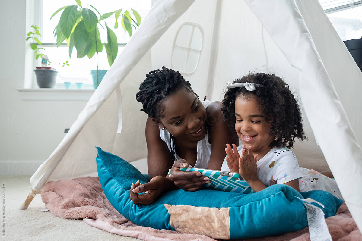 Mother and daughter in a tent