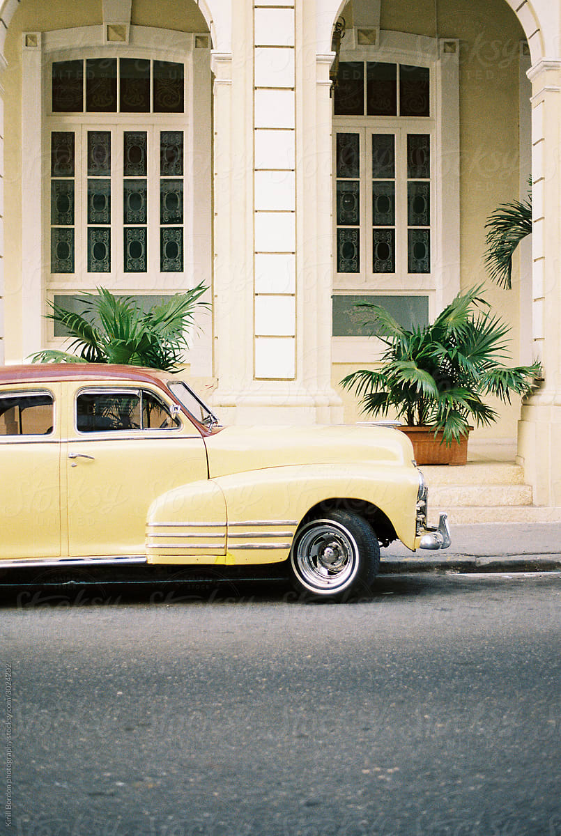 Classic yellow luxury car parked in Havana Cuba