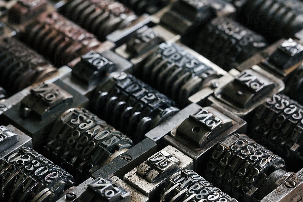 Macro of vintage metal numbering inserts for printer - horizontal