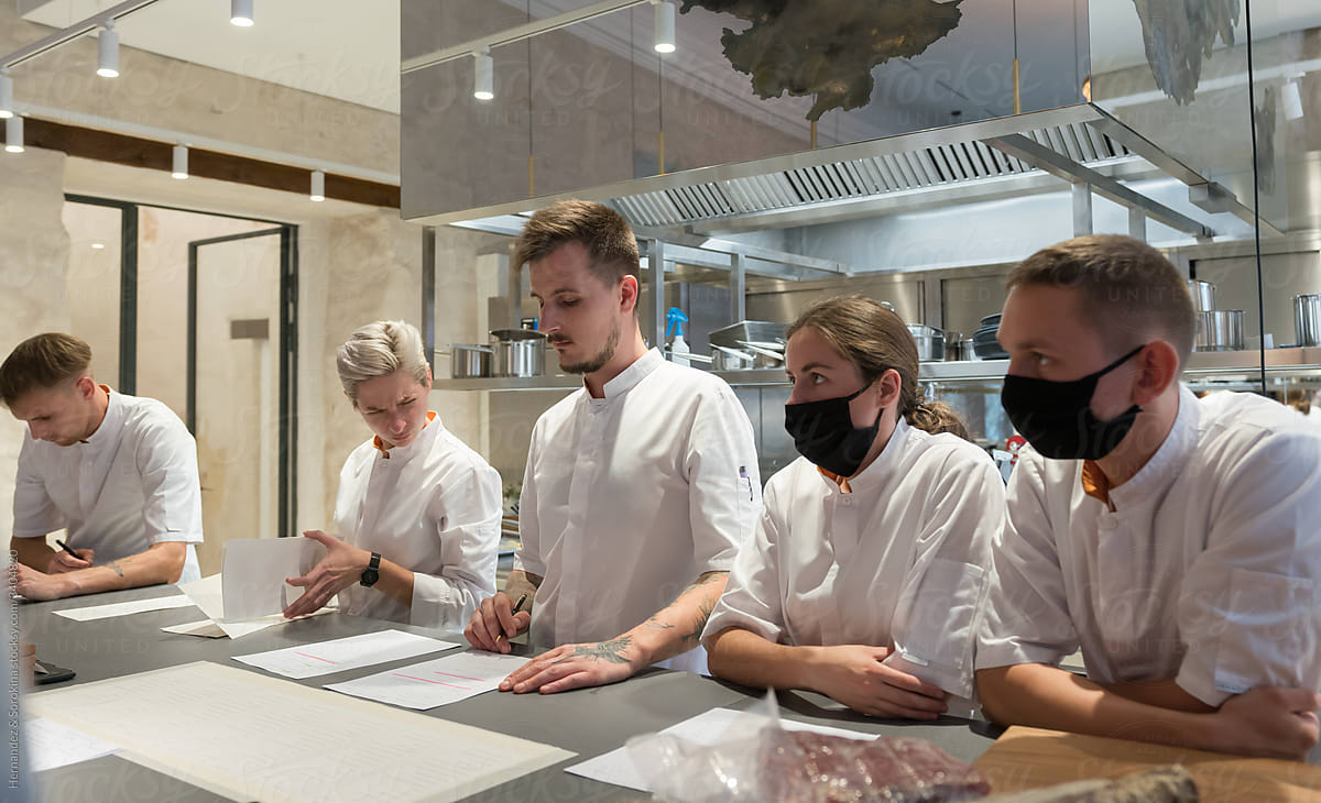 Meeting Of Cooks In Modern Kitchen