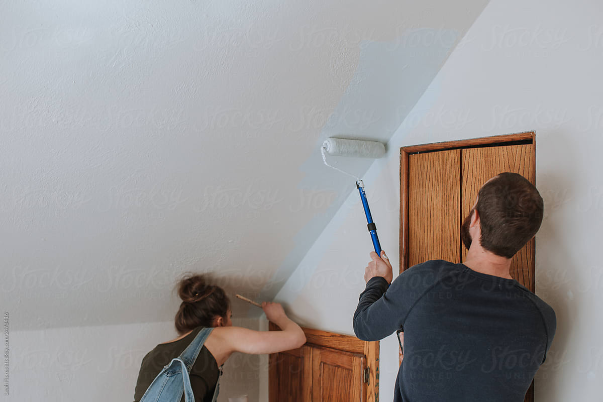 Couple Painting Room Together