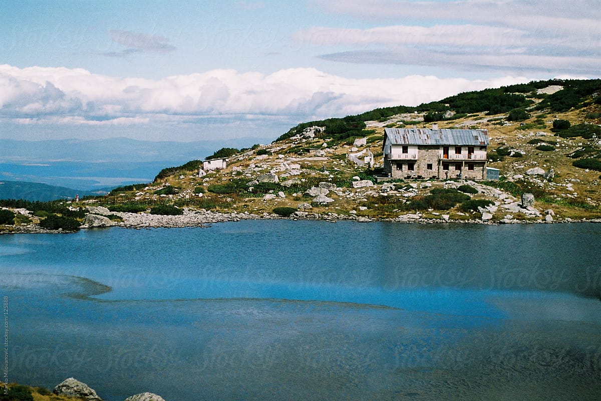 Abandoned hotel on lake in the mountain, house