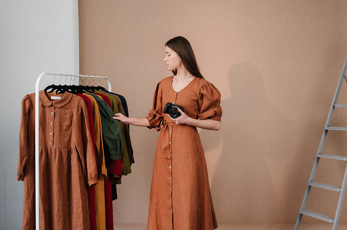 Woman preparing clothes for taking photos