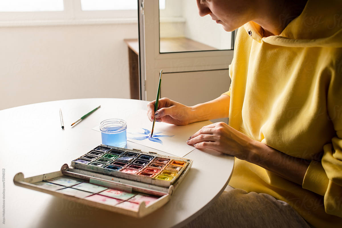 Woman drawing an illustration using a brush