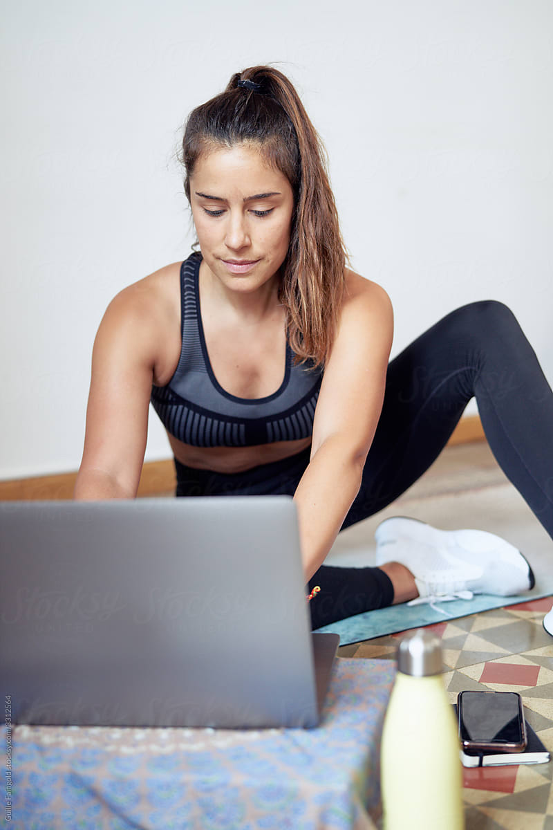 Sportswoman using laptop