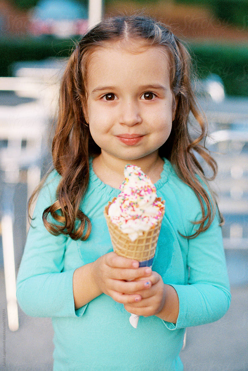 Cute Young Girl Holding A Large Ice Cream By Stocksy Contributor Jakob Lagerstedt Stocksy