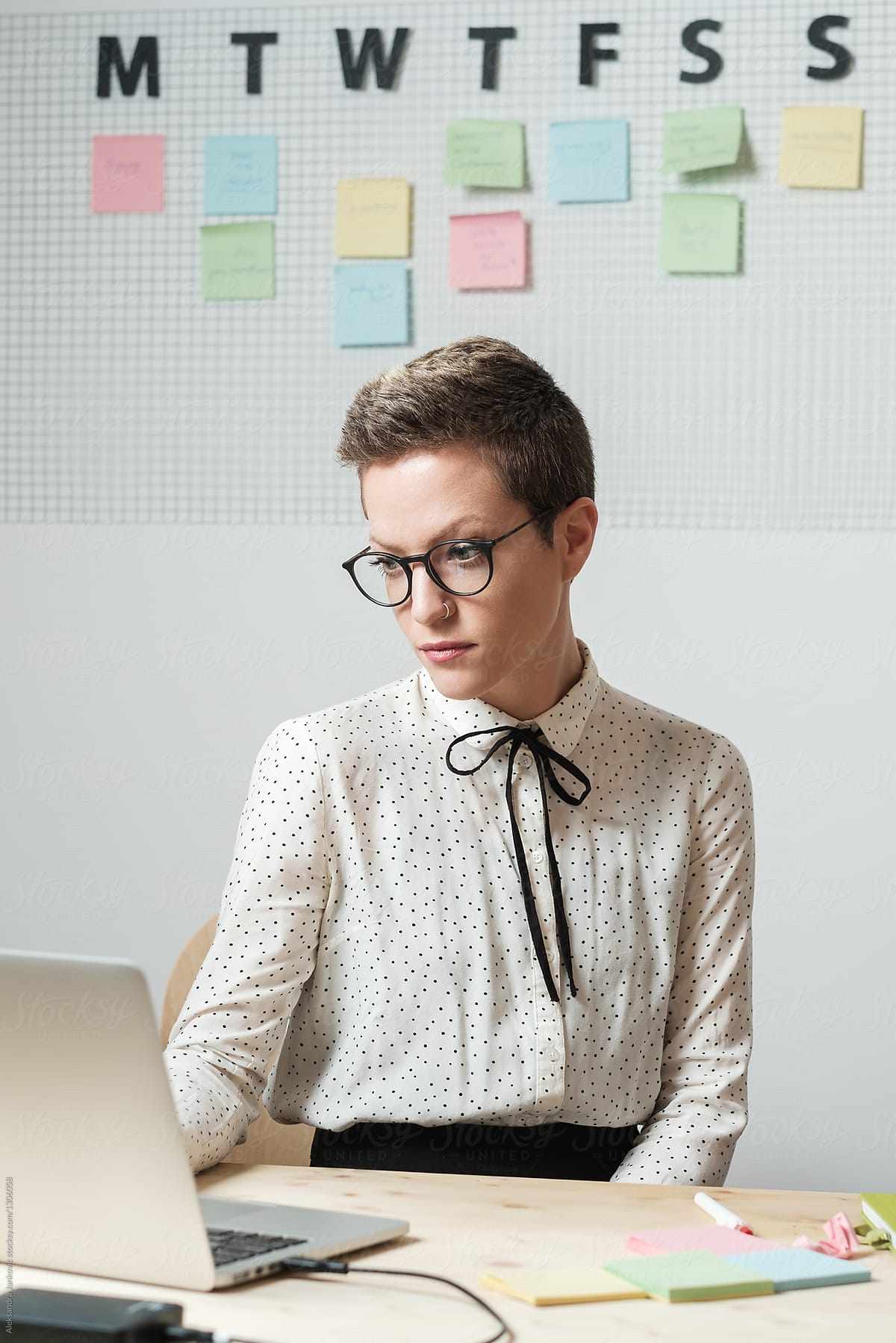 Stylish Caucasian Businesswoman With Glasses Working On The Laptop The Office