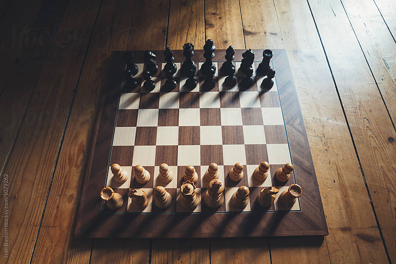 Wooden chess board on parquet