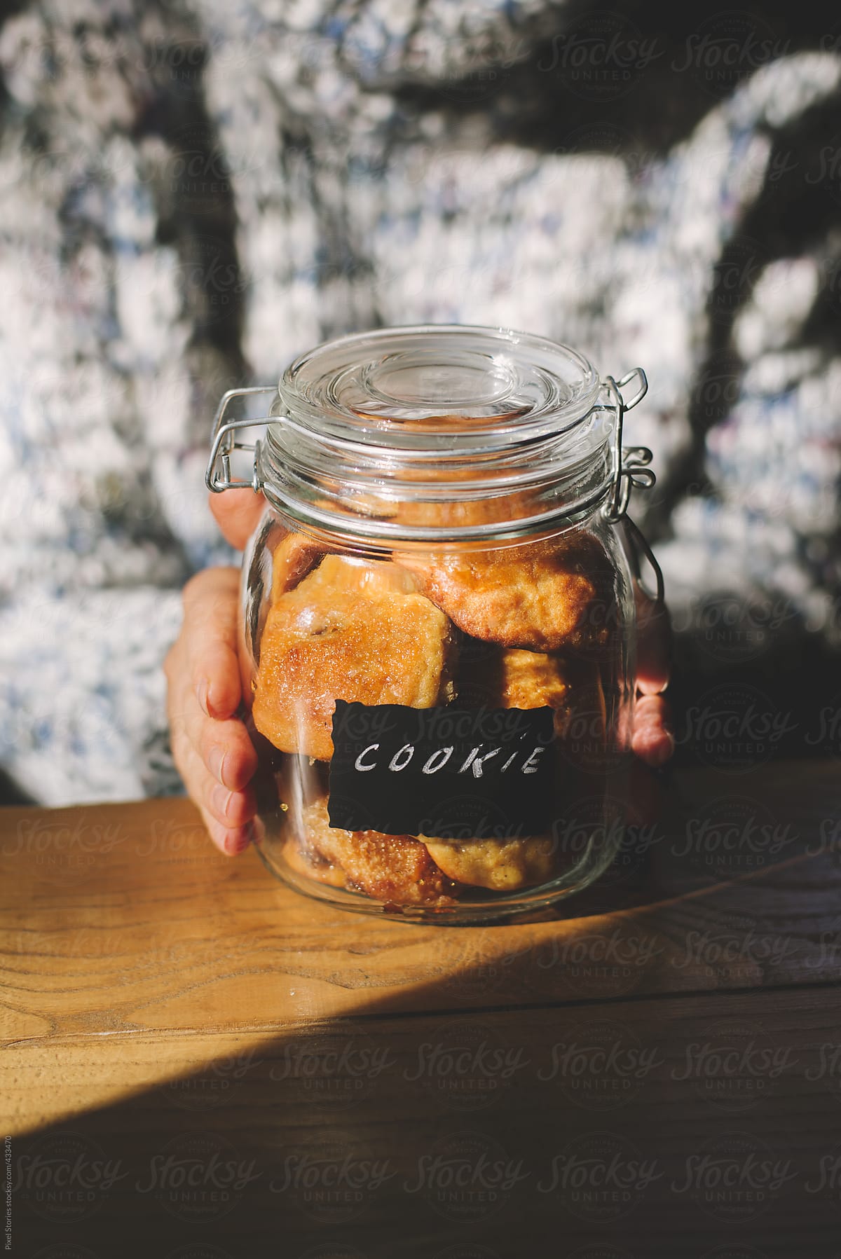 Food: woman holding jar full of homemade cookies
