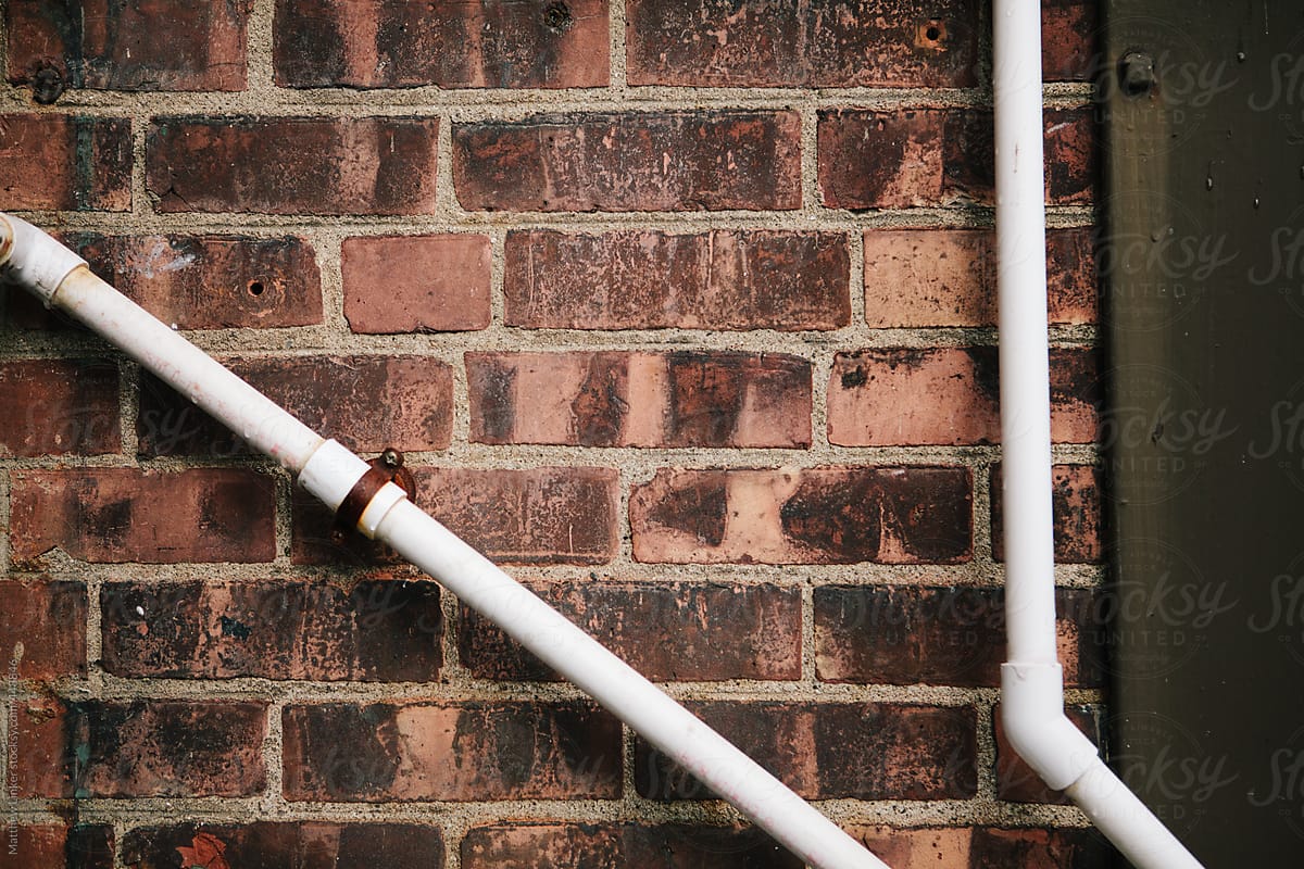 pipes on a brick wall