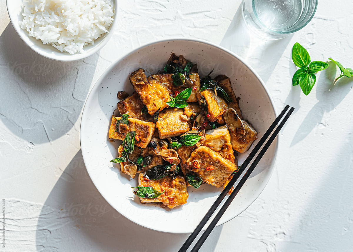Vegan tofu stir fry with bowl of rice