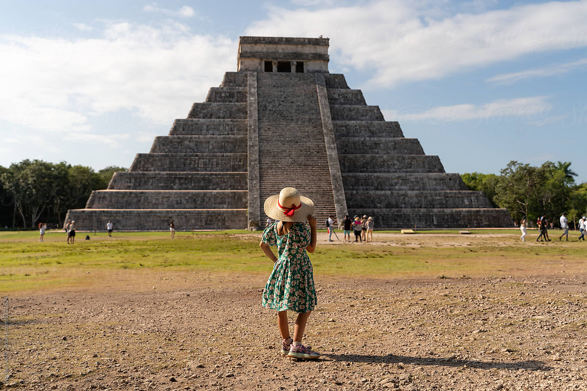 Travel with kids. Little girl in Chichen Itzá pyramid , Mexico