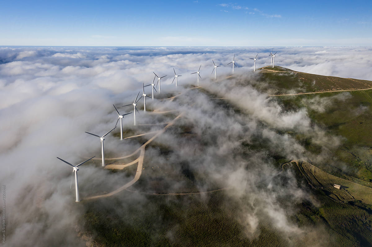 aerial view of wind generators in cloudy conditions