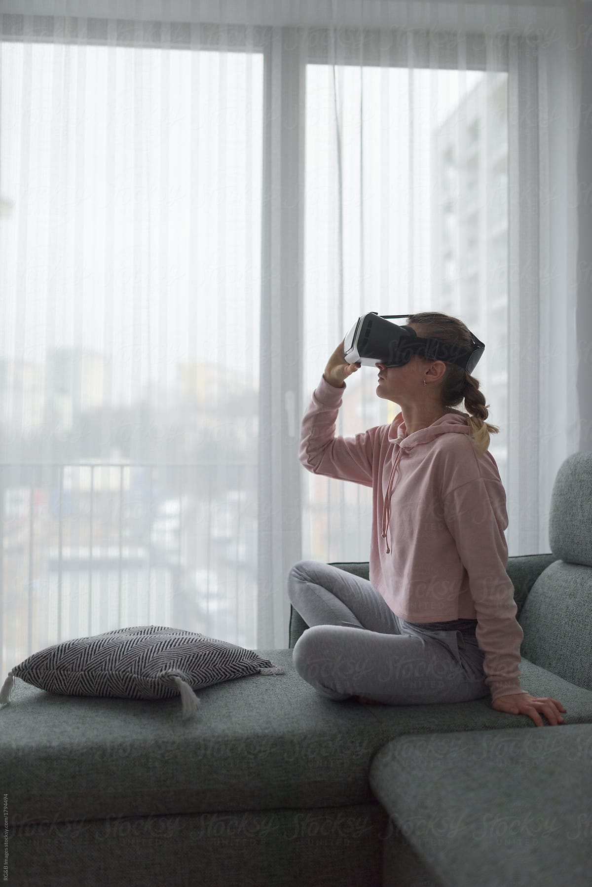 Woman exploring virtual reality at home