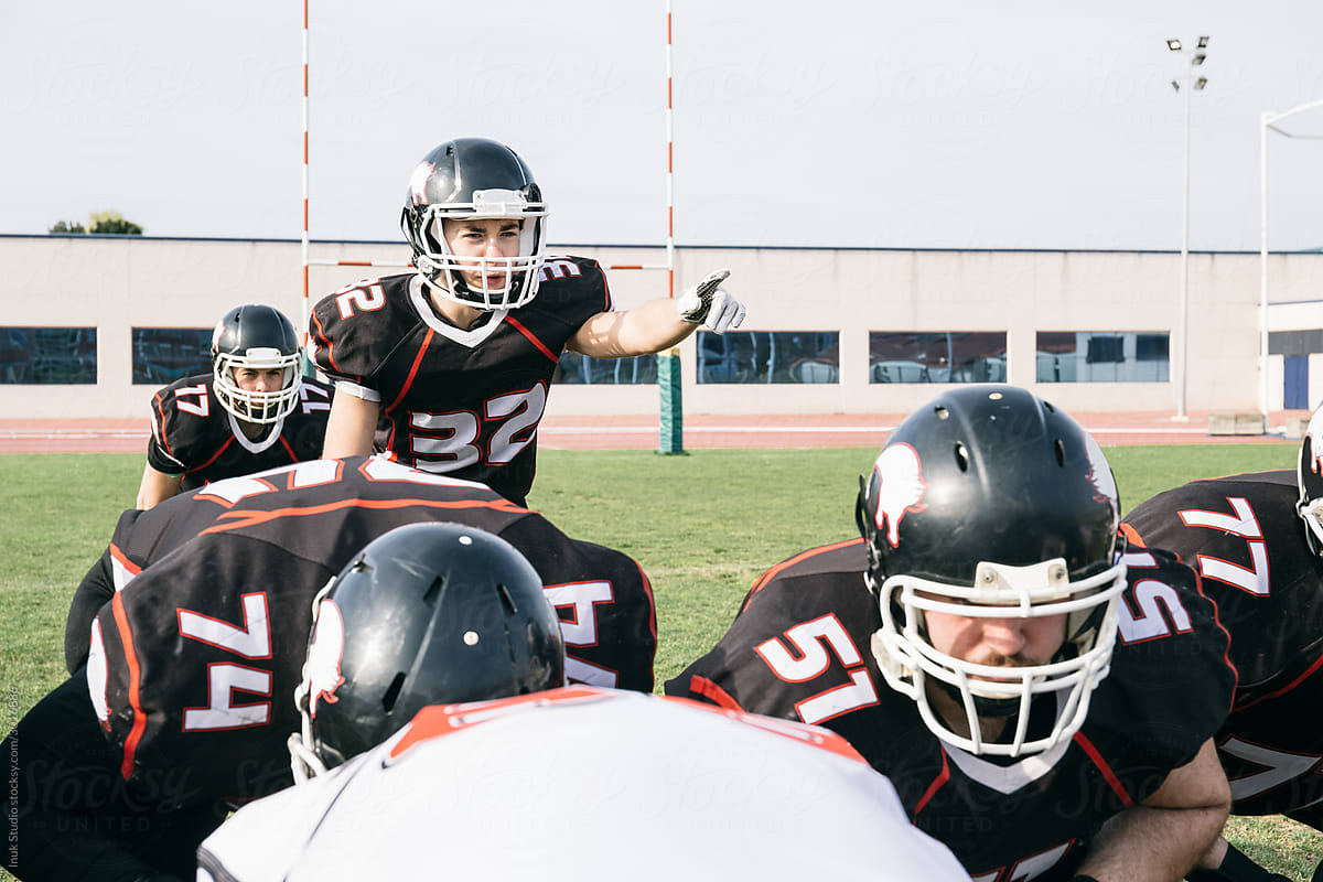 Man pointing while playing American football