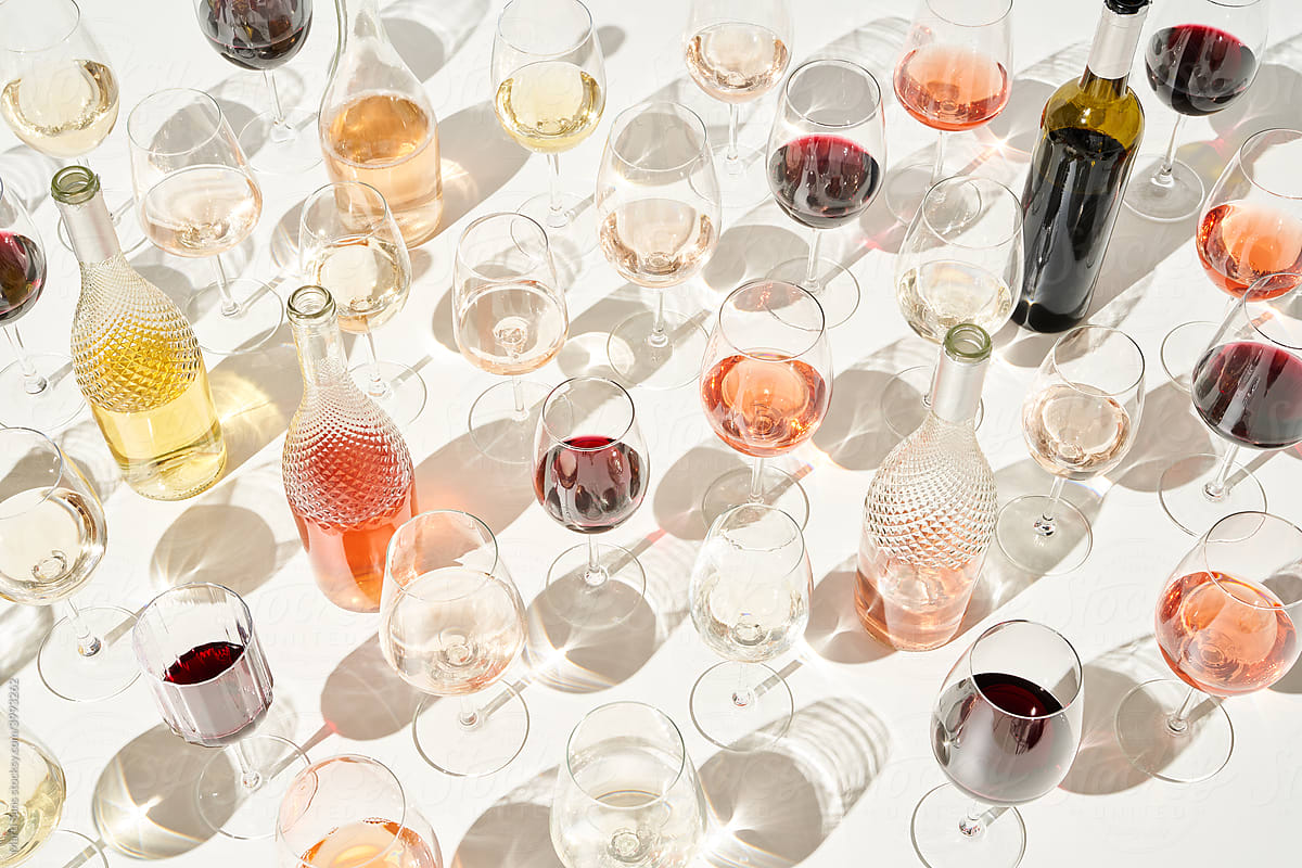 Wine and bottles on white.