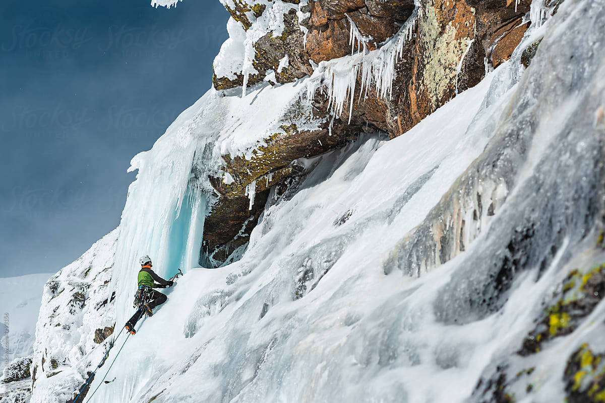 Ice Climber Admiring Hanging On Ice Axe