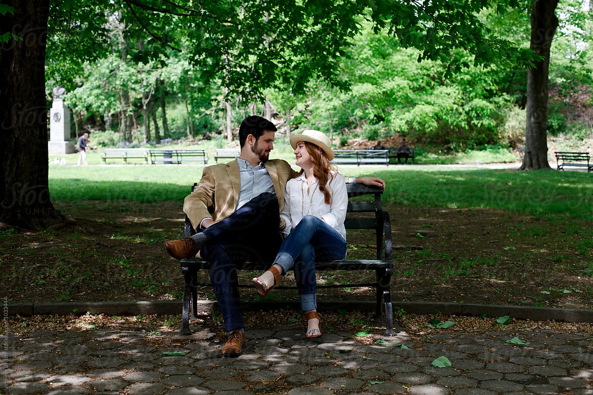 Couple In Love Sitting On Bench In Park By Jennifer Brister Stocksy United 