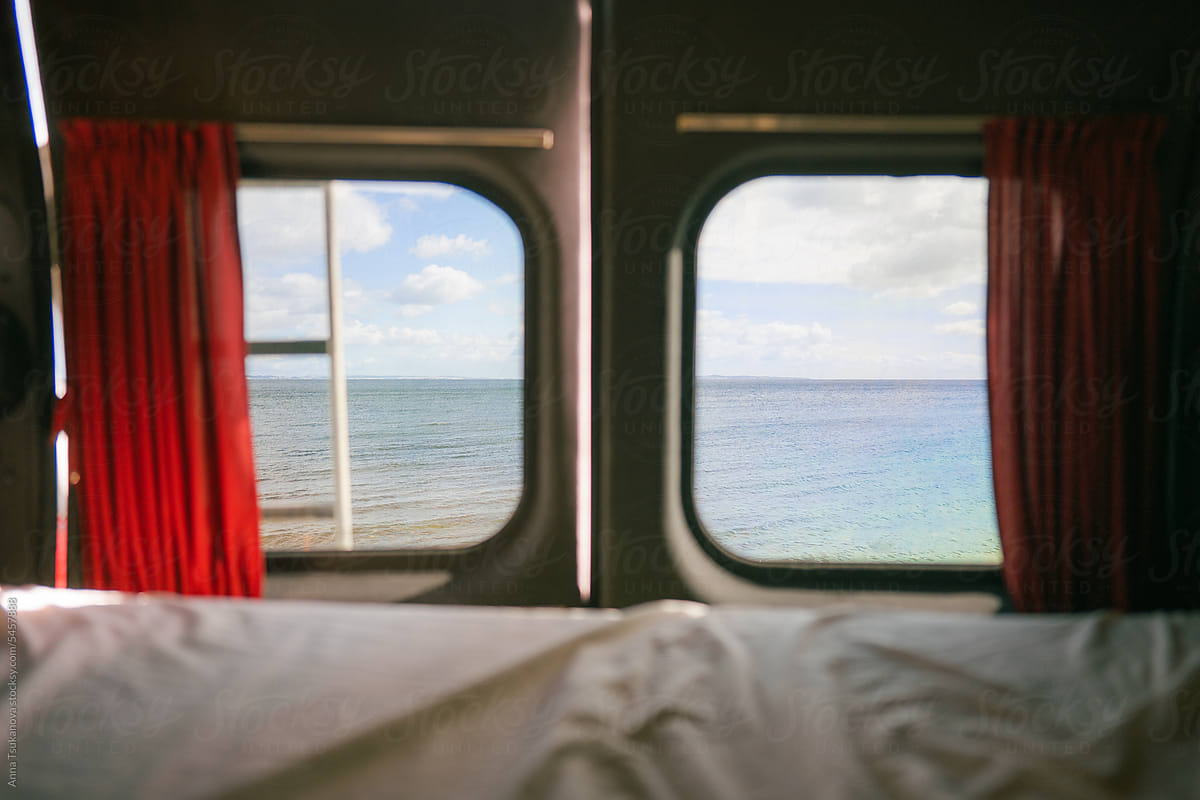 View of the sea from windows in camper van