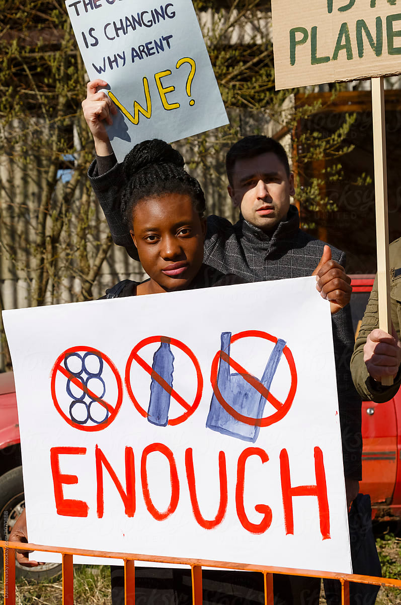 Black woman with poster during environmental protest