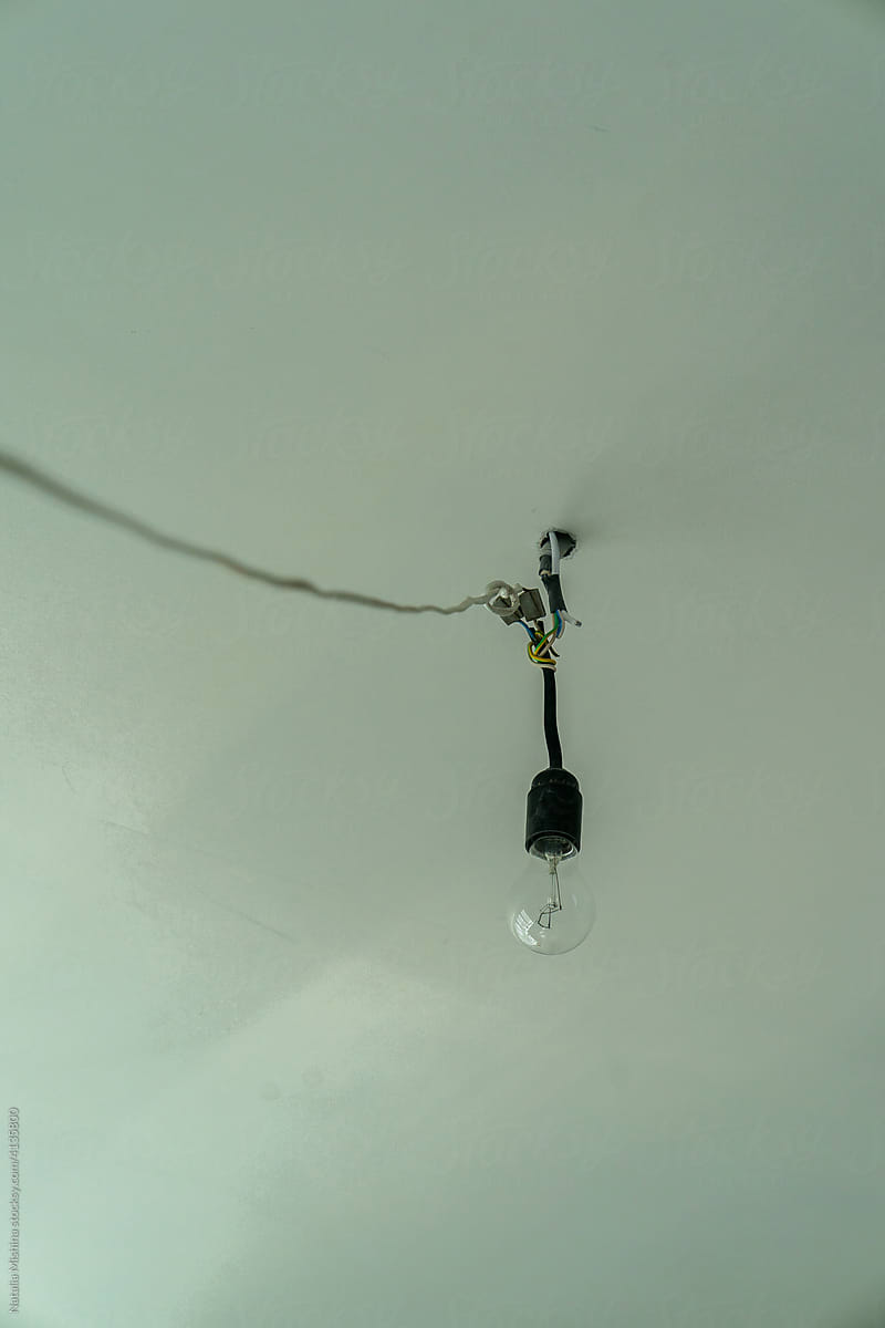 A light bulb on the ceiling.