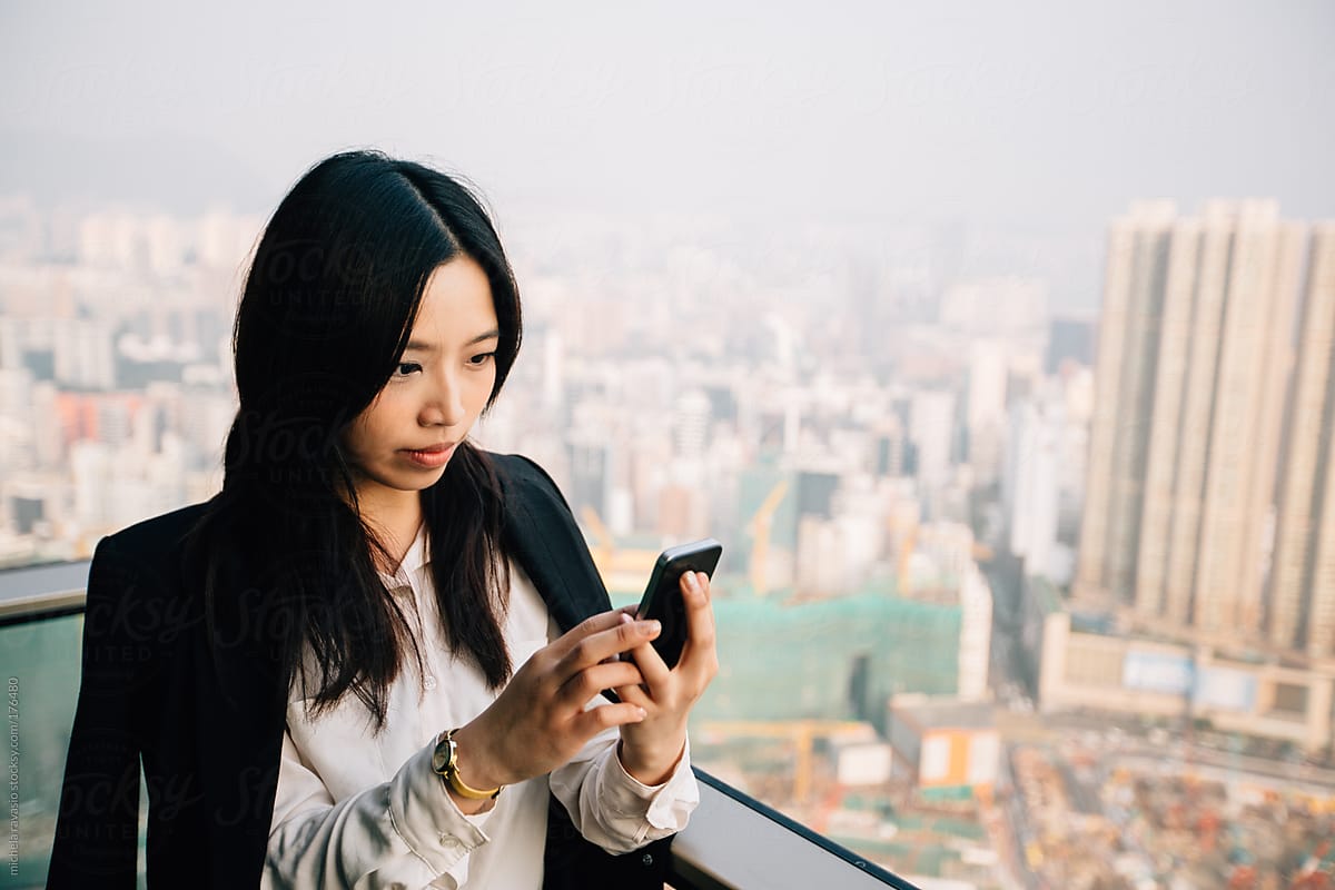 Asian businesswoman using her cellphone