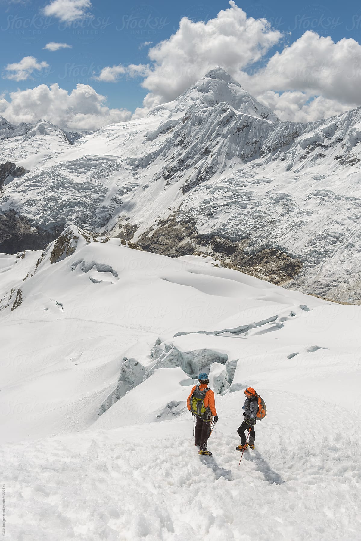 Mountain climbers  looking at Tocllaraju Peak in Cordillera Blanca, Peru