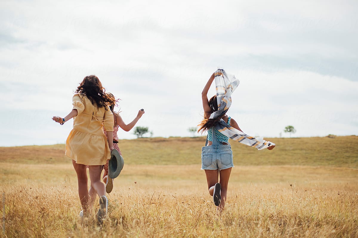 Three Girls Running in a Field by 