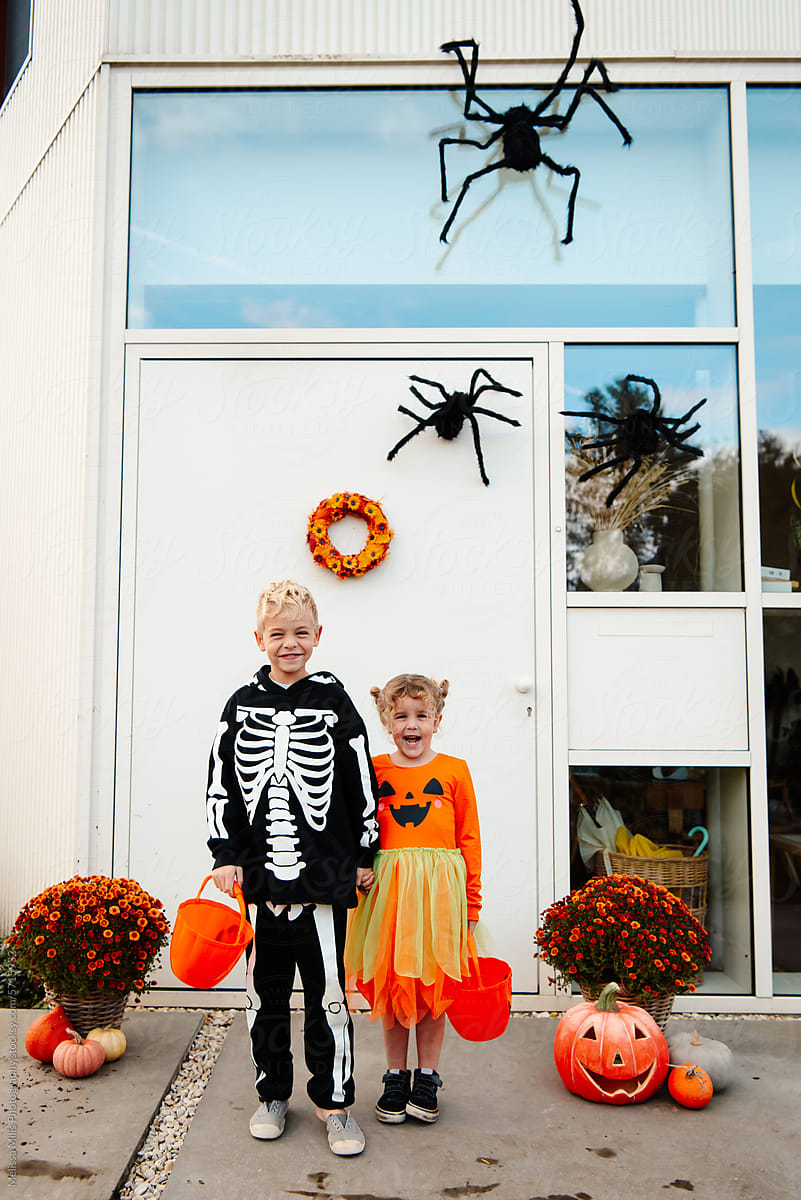 Excited Halloween for these 2 kids in front of their home
