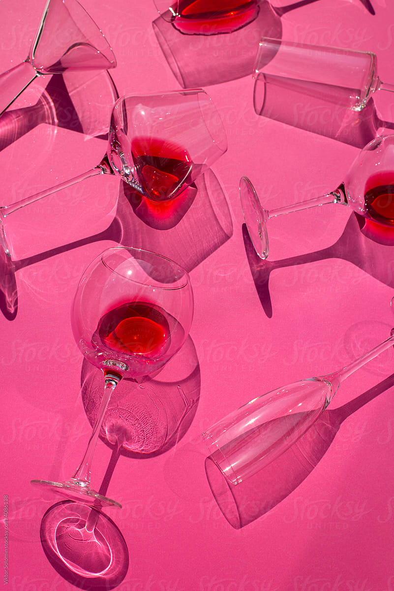 Glasses with red drinks in studio