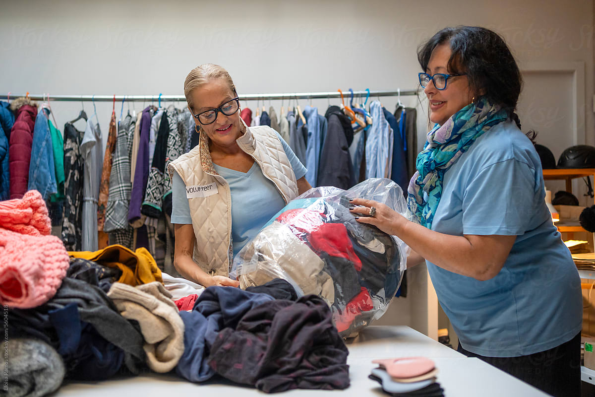 two matures women volunteering in a donation center