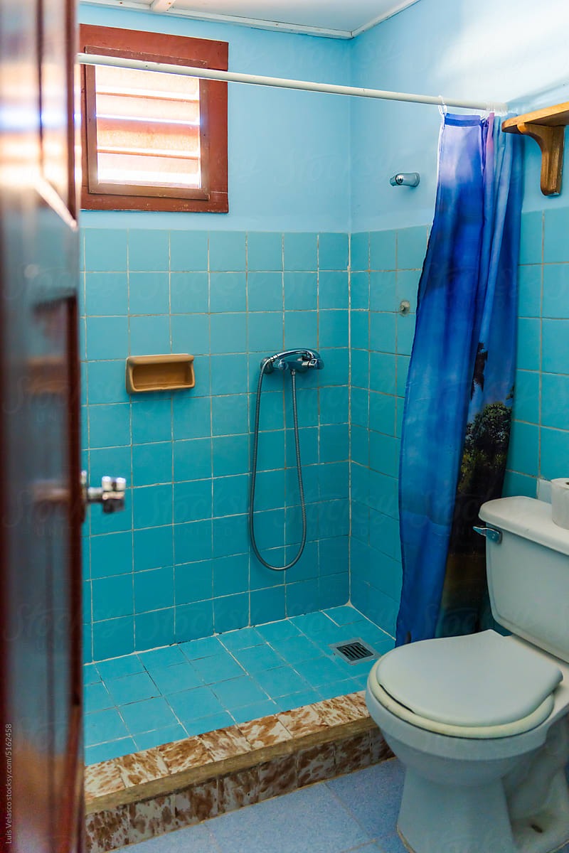 Empty Small Blue Tiled Bathroom